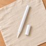 White fine-tip acrylic paint pen with cap